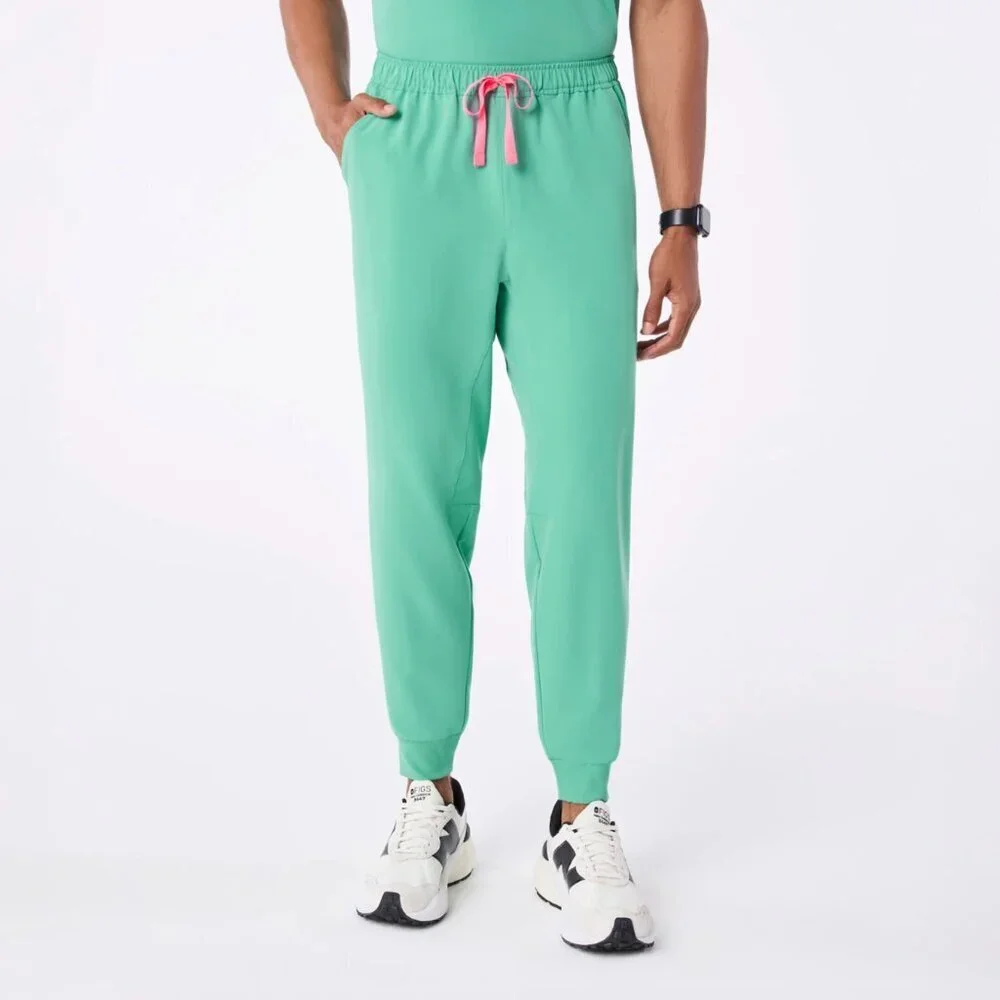 FIGS Men’s Tansen Jogger Scrub Pants in Surgical Green, size M